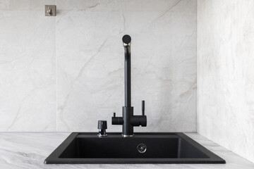kitchen faucet on a stylish metal sink
