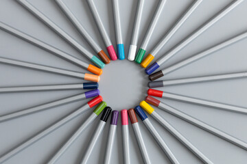 colored pencils on a gray background