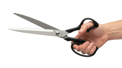 Hand holding open scissors with black handles for cutting paper or fabric on grey background