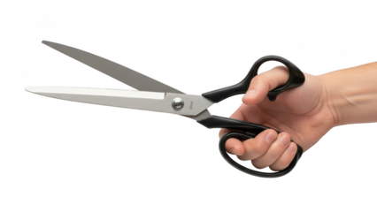 Hand holding open scissors with black handles for cutting paper or fabric on grey background