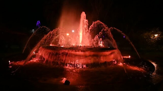 Illuminated fountain with changing colors , dynamic night video, Ferrol