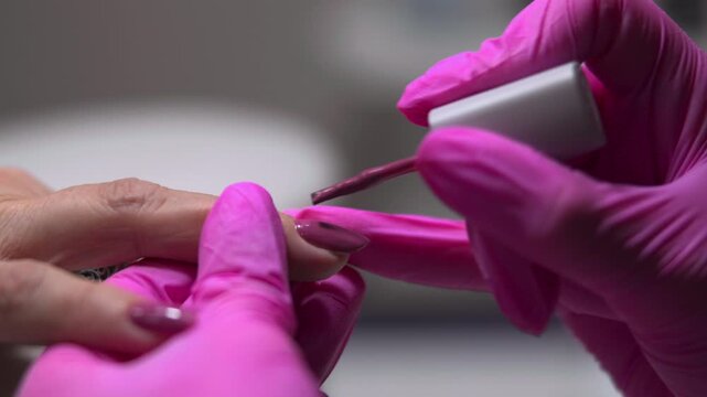 Meticulous Technician Ensures Perfect Nail Coverage And Flawless Edges In Cozy Salon Environment. Media