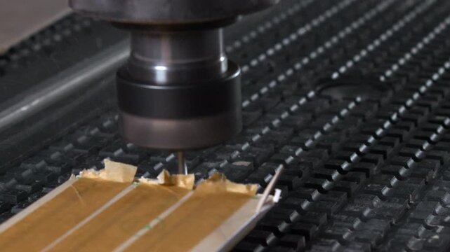 Rotating Cutter Shapes Tongue And Groove, Secure Clamping Ensures Steady Feed During Milling Operation. Media