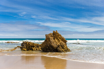 Witness the breathtaking coastline of Victoria, Australia, showcasing unique rock formations and pristine sandy beaches under a clear blue sky at Aireys Inlet along the Great Ocean Road