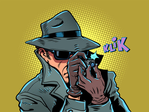 A male detective takes a photo. Surveillance of personal data and photographs. The state is spying on citizens.