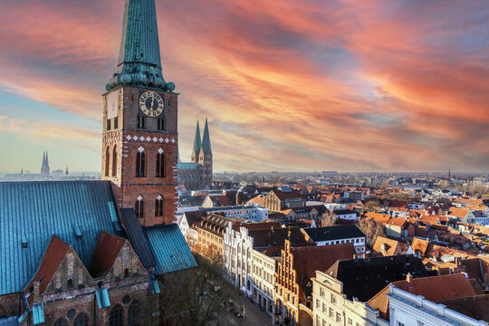 Sunset sky over Lubeck Germany aerial view of historic city
