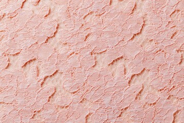 Delicate lace fabric texture background in soft pink hue, showcasing intricate patterns and fine details, perfect for elegant design projects and creative applications