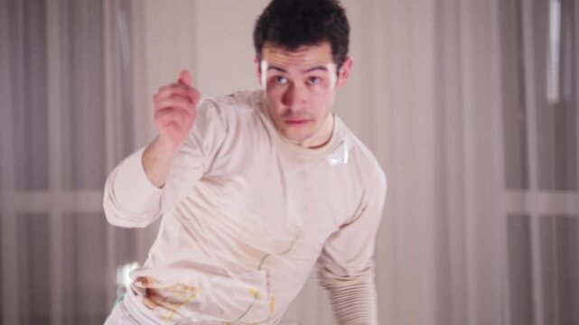 Martial arts. A professional man performing an acrobatic capoeira elements