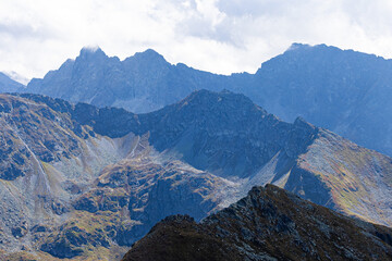 Layered mountain ridges and rocky terrain seen from Zawrat Pass