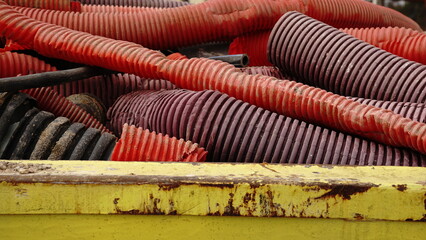 corrugated plastic tube in yellow container