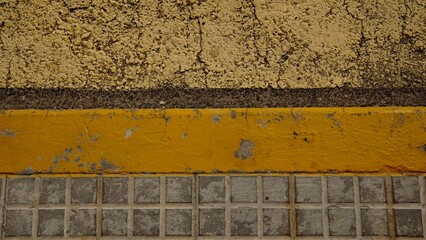 yellow sidewalk step on asphalt street background