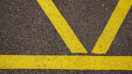 yellow paint marks on asphalt as a background
