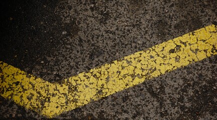 yellow paint line on asphalt