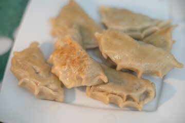 Fried dumplings filled with sauerkraut and mushrooms served as a traditional Polish Christmas Eve dish