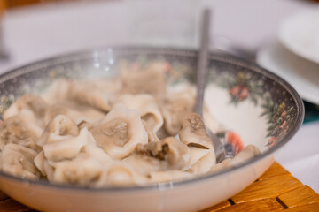 Traditional Polish Christmas Eve dish of mushroom filled dumplings known as uszka served in a bowl