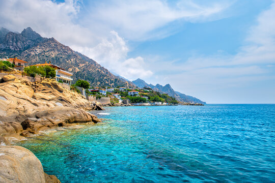 Karkinagri village small town townscape houses mountains cliff on Ikaria, Greece longevity blue zone Aegean island on Icarian sea