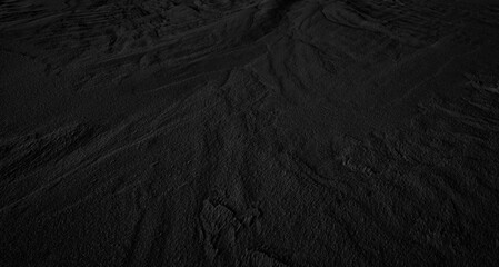 Fototapeta premium Black and White Sand beach macro photography. Texture of black and whote sand for background. Close-up macro view of volcanic sand surface black and white color. Black texture sand in the desert.