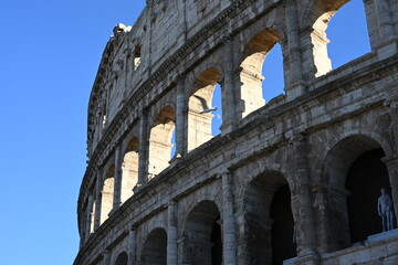 Fototapeta premium Partial view of the Colosseum with moon and seagull flying