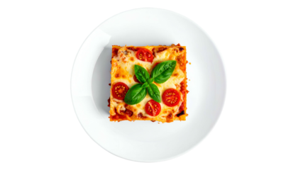 Overhead shot of a square lasagna slice on a white plate, garnished with tomatoes and basil