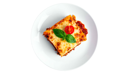 Overhead view of a delicious lasagna slice on a white plate, topped with tomato & basil