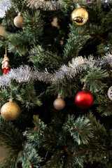 christmas tree with tinsel and baubles as decorations