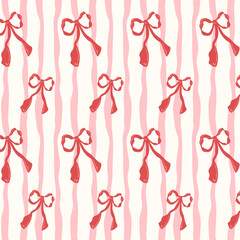 Seamless pattern with a red bow and pink wavy vertical stripes on a white background. Cute design for wrapping paper or fabric printing.