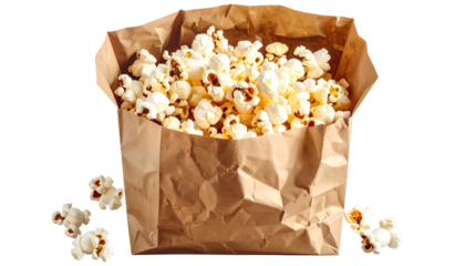 Brown paper bag overflowing with freshly popped popcorn; kernels scattered below