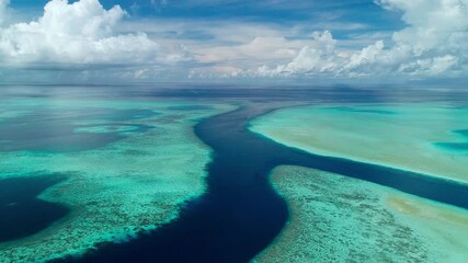 Ascending aerial shot of remote Marine Conservation Area of Ebiil Channel in Palau.