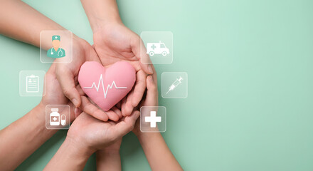 hands holding pink heart with medical symbols