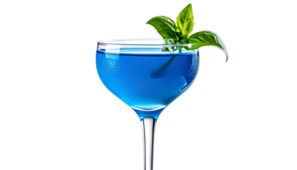 Vibrant blue cocktail in a coupe glass, garnished with fresh green basil leaves