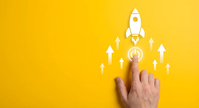 launch startup concept with hand pressing button