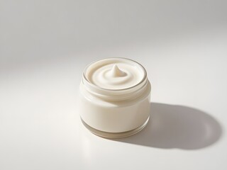 Luxurious white cream in elegant glass jar on clean surface