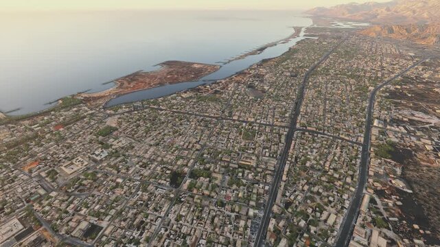 Top aerial drone shot at sunset of Ras Al Khaimah in Ras Al Jaima. United Arab Emirates