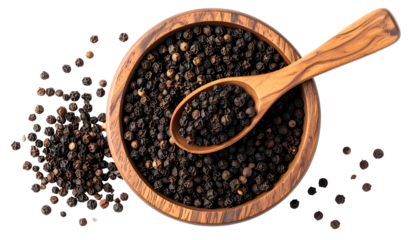 Overhead shot of whole peppercorns in a wooden bowl with a spoon. Some spilled