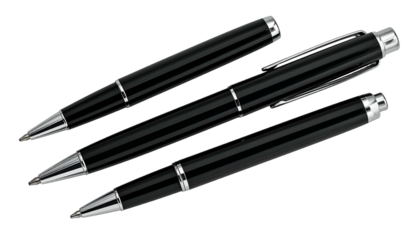 Close-up of three black pens with silver accents, against a pure black background