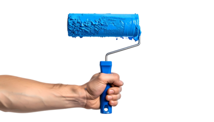 Hand holding a paint roller dripping with vibrant blue paint against a stark black background