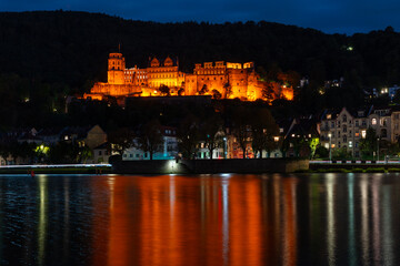 Heidelberg Castle Neckar River at Night.Heidelberg castle reflected in the Neckar River at night. Heidelberg, Germany.
