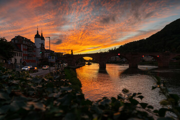 Karl Theodor Bridge and Castle in Heidelberg at Night. The Karl Theodor Bridge reflected in the Neckar River. Heidelberg, Germany.
