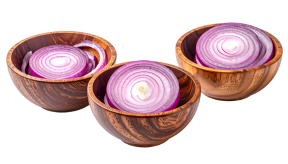 Sliced red onions in wooden bowls against black