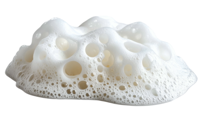 Macro view of a white, porous foam formation, possibly soap or bubbles