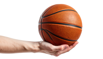 A hand holds a basketball against a black backdrop, showcasing the ball's texture