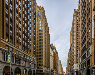 Lower Manhattan street intersection with historic office towers in New York City