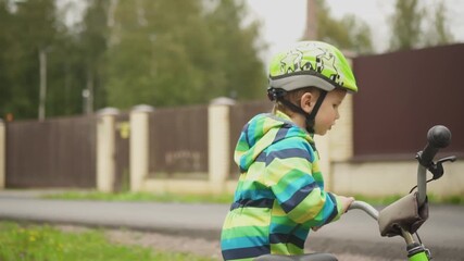toddler ready for cycling with correct helmet usage showing safety importance visually.