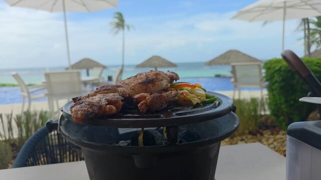 BBQ Roasted Chicken on The Hot Charcoal Grill Close-up. Tasty Snack For Outdoor BBQ in vacations.