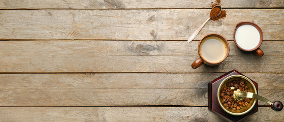 Hot coffee, milk and grinder on wooden background © Pixel-Shot