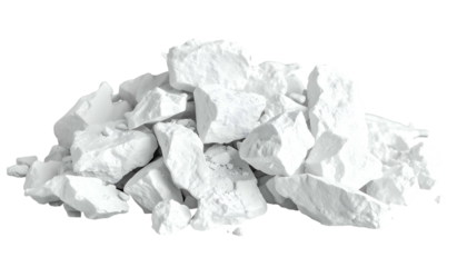 A pile of irregular, white, broken chunks, possibly chalk or stone, against a black backdrop