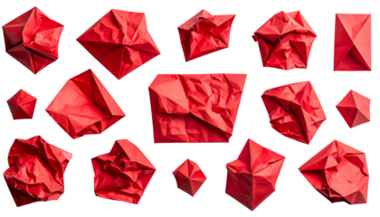 Isolated crumpled and folded red paper shapes against black. Variety of origami forms