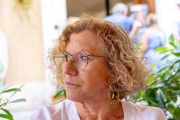 attractive senior woman with blonde curly hair