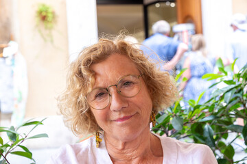 attractive senior woman with blonde curly hair