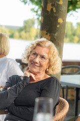 attractive senior woman with blonde curly hair